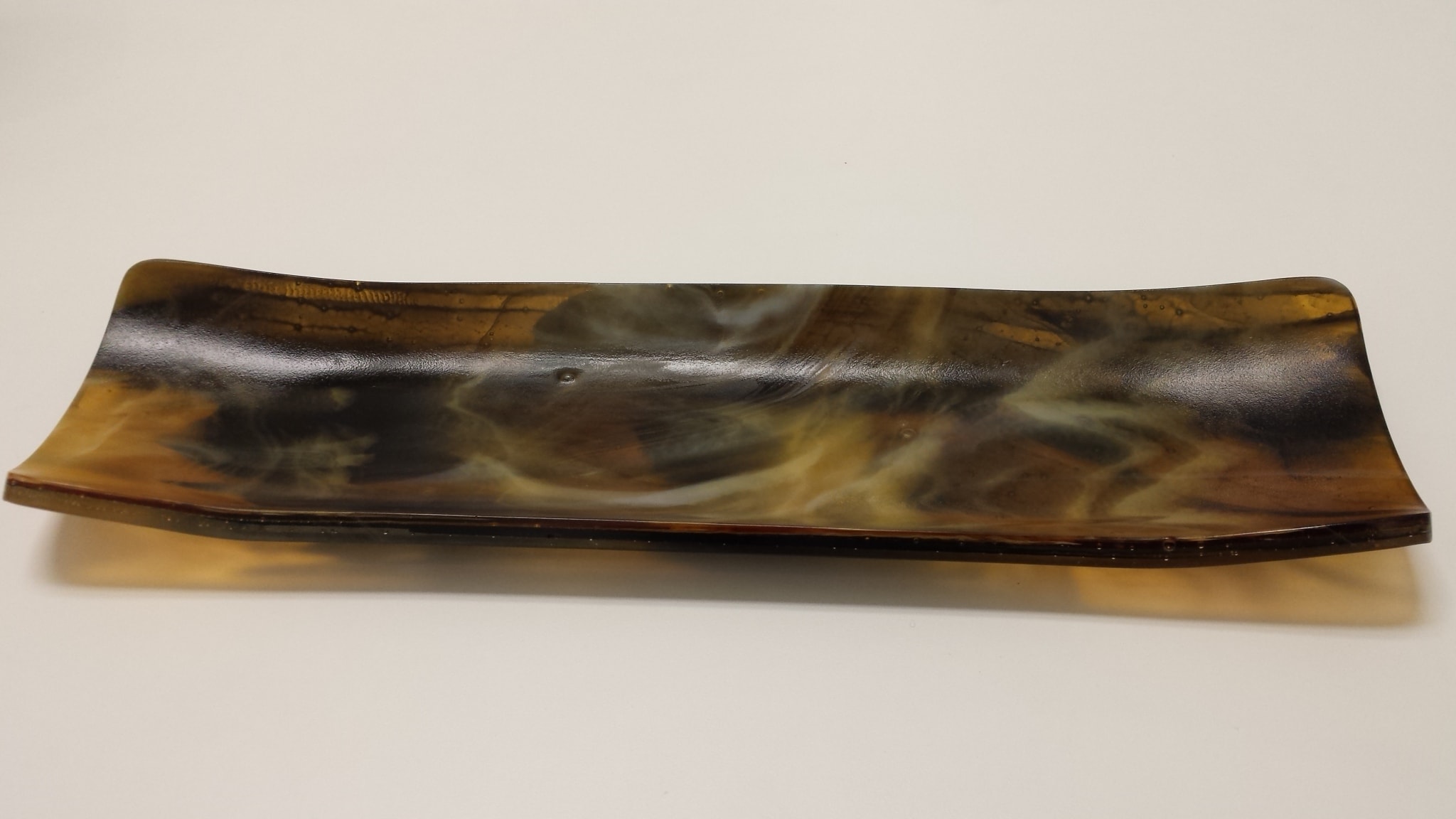 Channel plate made with two different streaky glass layers