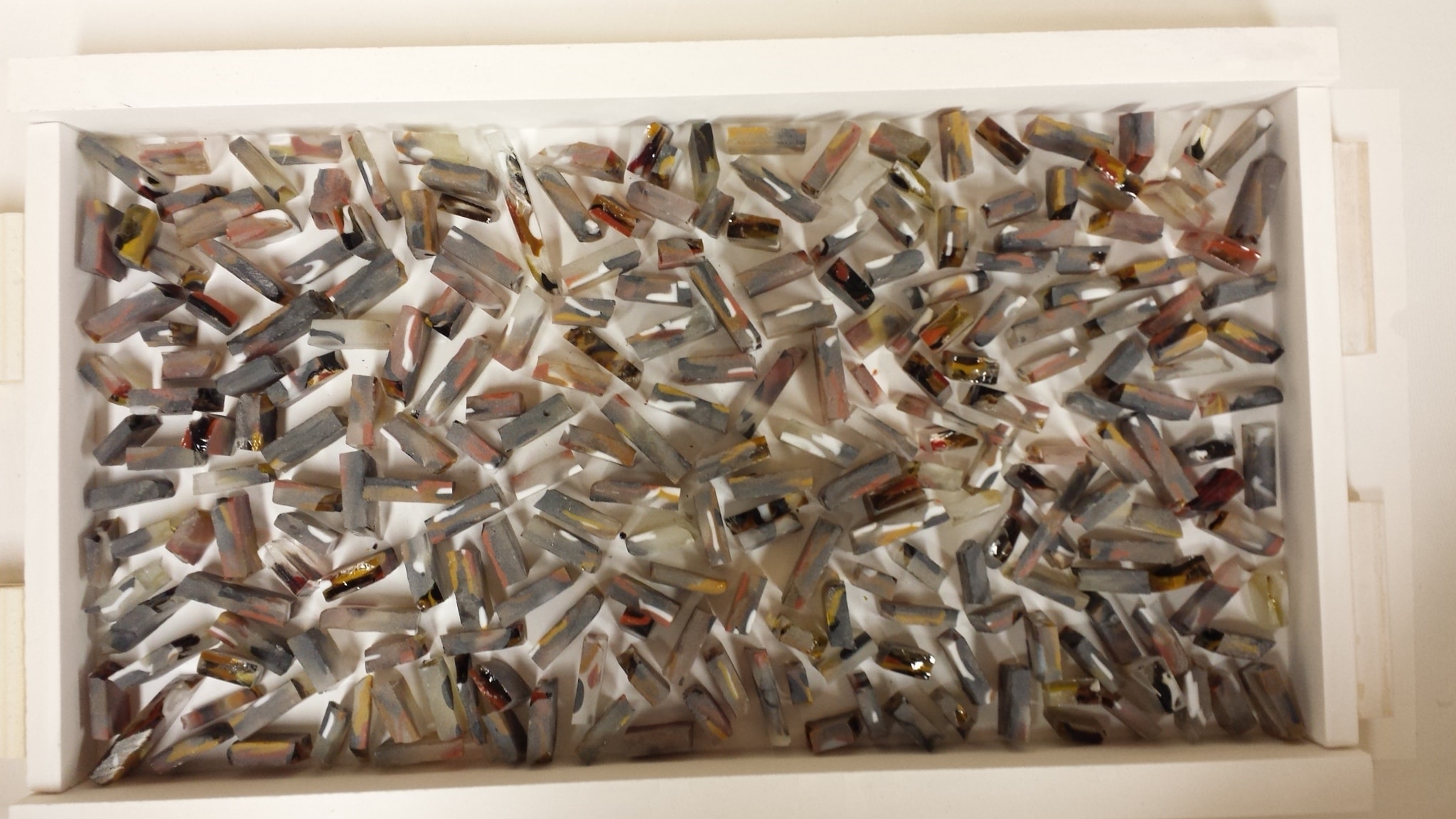 This is an overhead view of a work in progress. These pieces will be fully fused and then cut for cabinet pulls, which I used in our home.